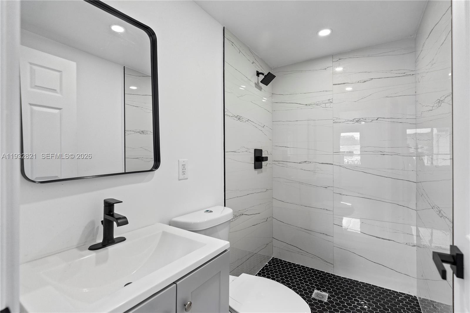 5658 Southwest 1st Street Miami, FL 33134 - Photo 32 of 50 a bathroom with a sink toilet and shower