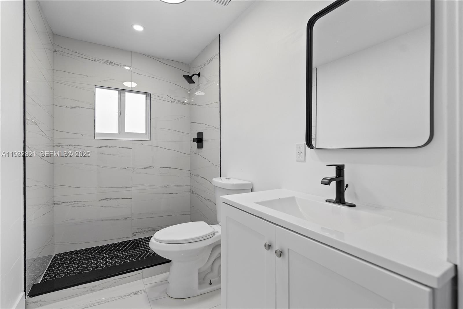 5658 Southwest 1st Street Miami, FL 33134 - Photo 33 of 41 a bathroom with a sink a toilet and shower