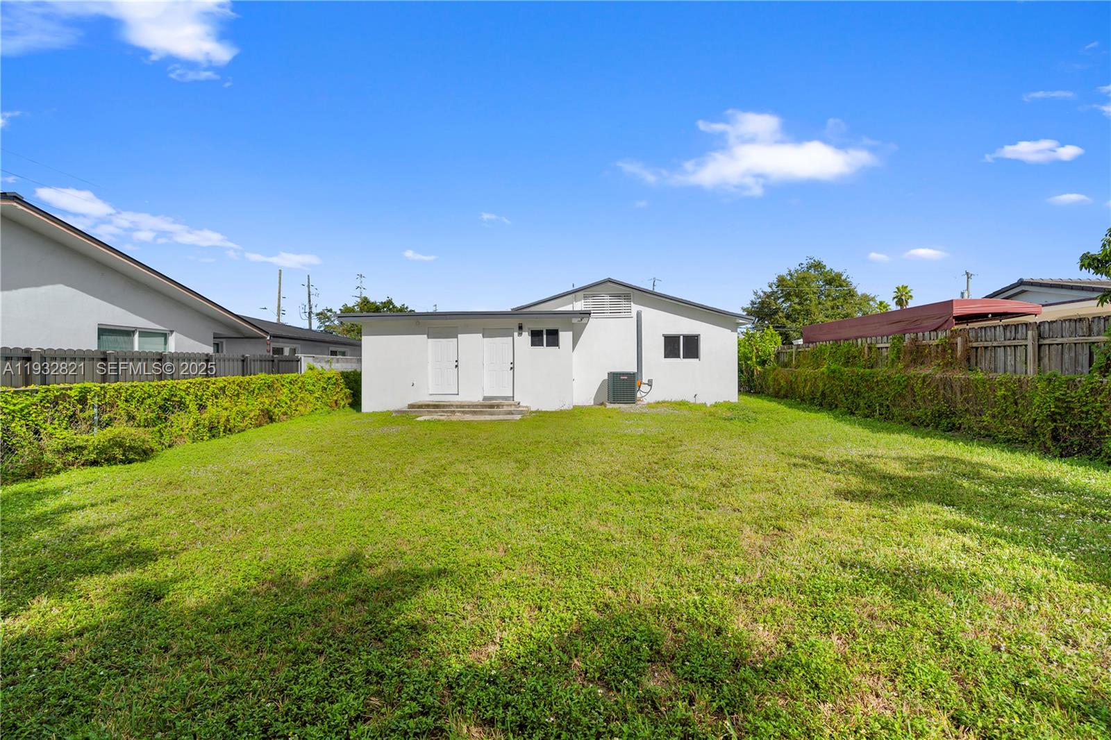 5658 Southwest 1st Street Miami, FL 33134 - Photo 38 of 41 a big house with green field in front of it