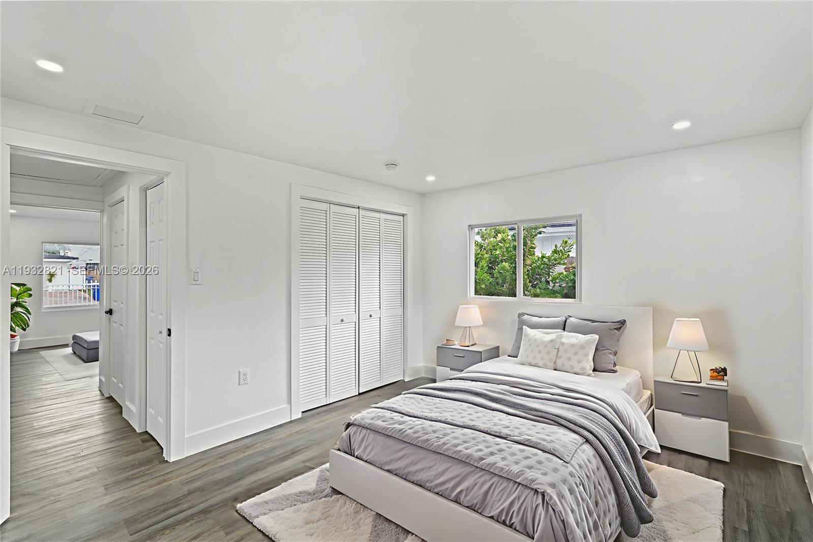 5658 Southwest 1st Street Miami, FL 33134 - Photo 44 of 50 a bedroom with a bed and a window