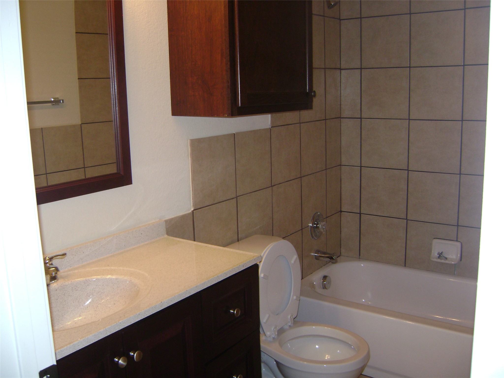 2507 Oak Lane, Unit A Georgetown, TX 78628 - Photo 8 of 11 Tiled walls and a spacious tub offer a comfortable, convenient bathroom.