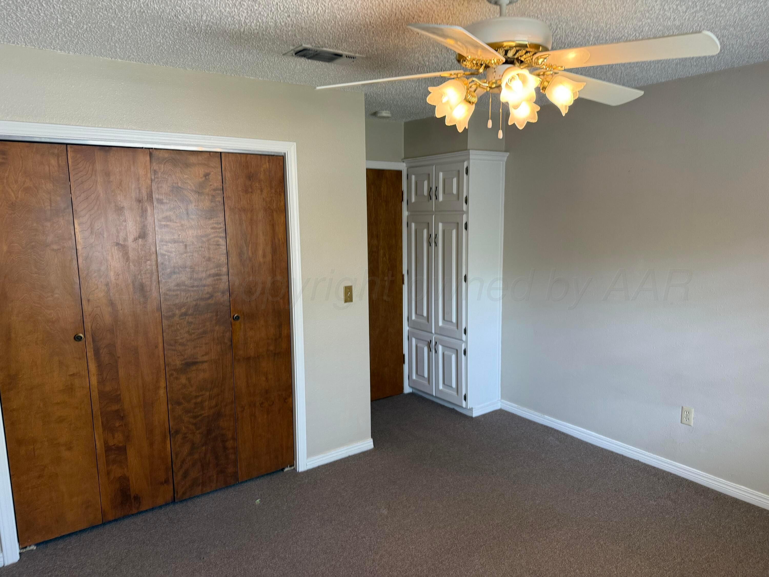 505 Harrell Lane Canyon, TX 79015 - Photo 11 of 14 a view of a chandelier fan in a room