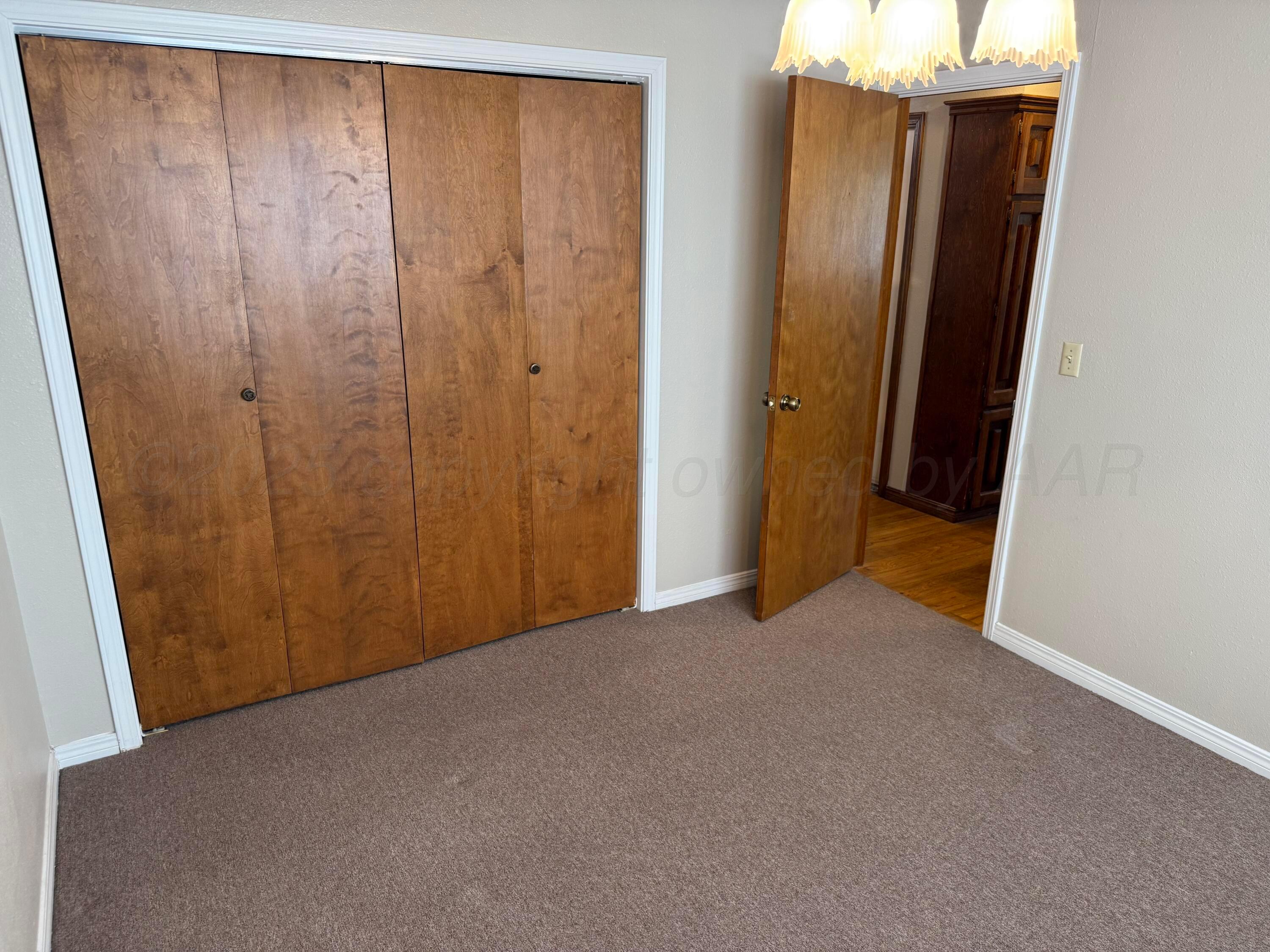 505 Harrell Lane Canyon, TX 79015 - Photo 8 of 14 an empty room with wooden floor