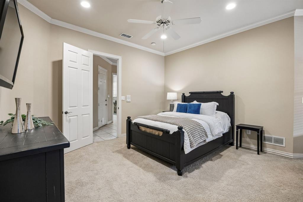1135 Copper Canyon Road Copper Canyon, TX 76226 - Photo 35 of 40 Comfortable Bedroom With Ceiling Fan And Jack-And-Jill Access