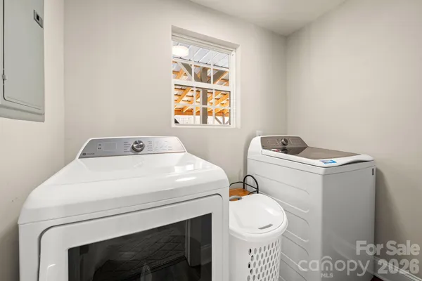 a utility room with dryer and washer