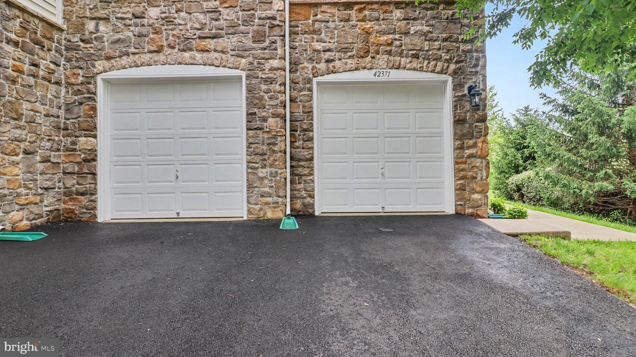 42371 Trellis Square Brambleton, VA 20148 - Photo 4 of 70 Charming dual garage entryway.