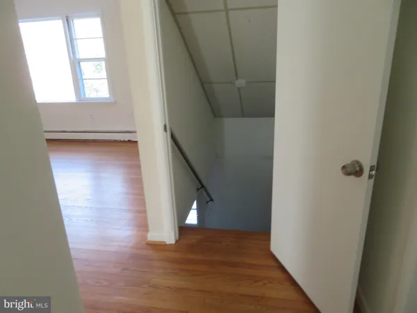 a view of entryway with wooden floor