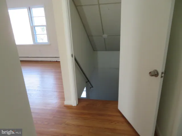 a view of entryway with wooden floor