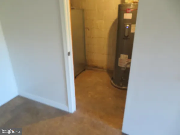 an empty room with closet and bathroom