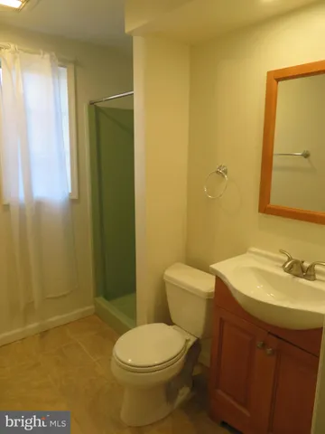 a view of hallway with wooden floor