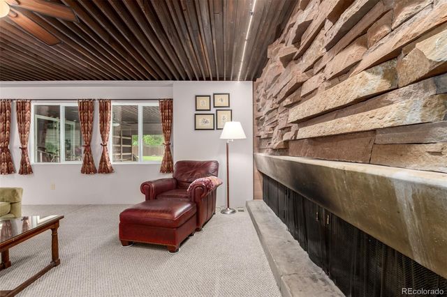 a kitchen with stainless steel appliances kitchen island granite countertop lots of counter top space and a sink