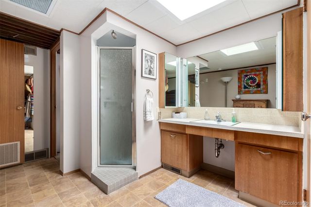 a view of a house with a yard and a garden