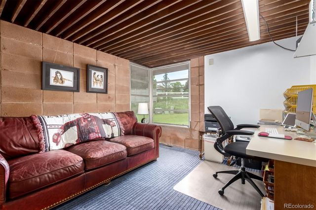 a view of a chair and table in the garden