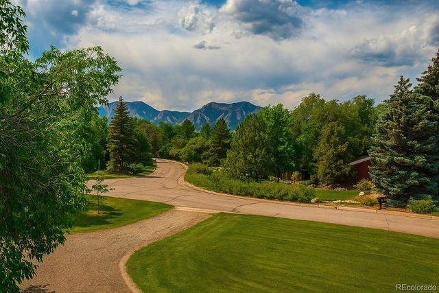 a view of a patio with a table and chairs