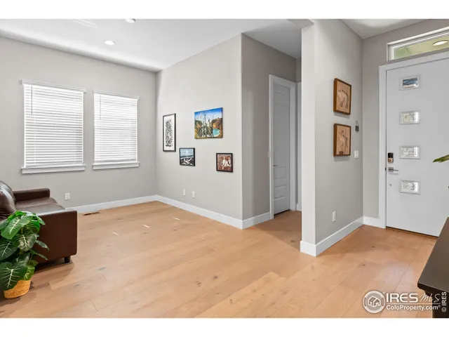 a bedroom with a bed and a night stand