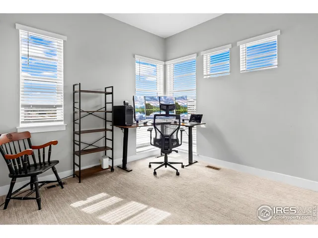 a workspace with furniture and a window