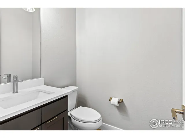 a backyard of a building with barbeque oven