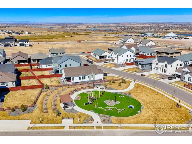 an aerial view of a house with a swimming pool