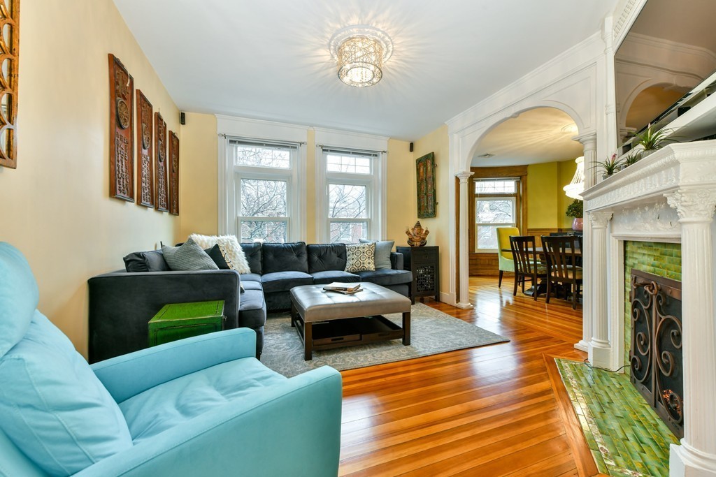 17 Strathmore Road, Unit 3 Brookline, MA 02445 - Photo 2 of 24 a living room with fireplace furniture and a wooden floor