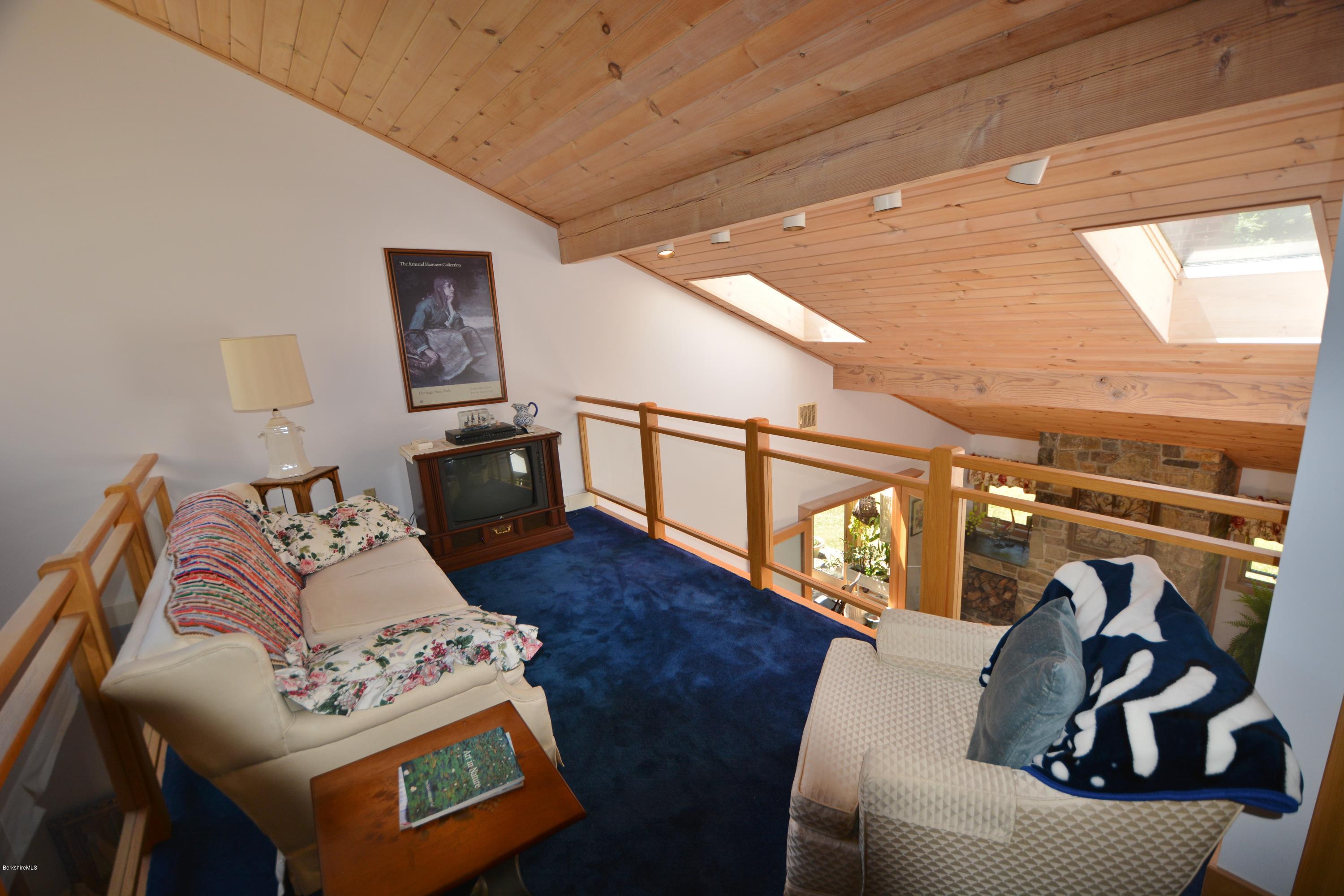 1304 West Center Road Otis, MA 01253 - Photo 14 of 28 a living room with furniture and a wooden floor