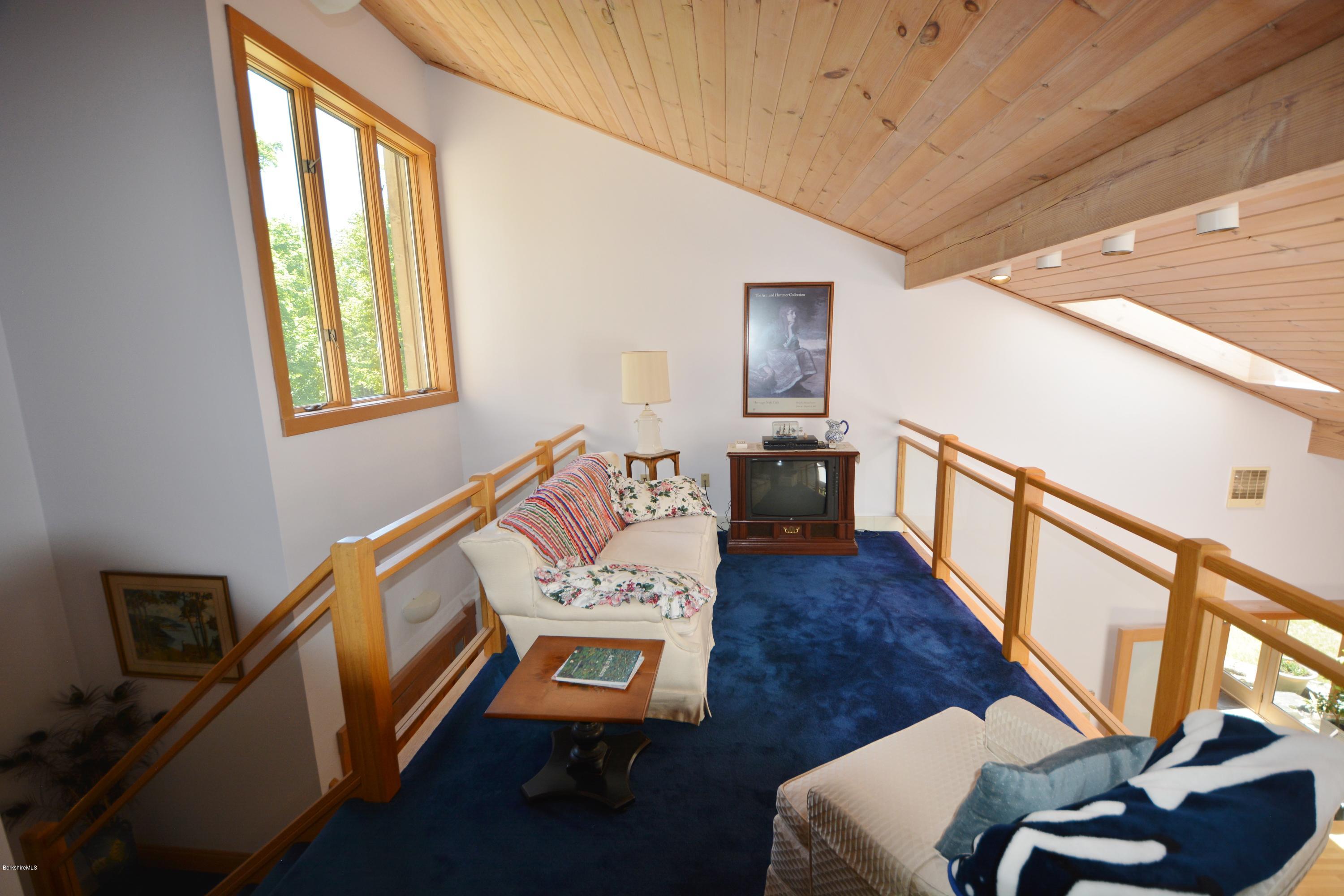 1304 West Center Road Otis, MA 01253 - Photo 16 of 28 a living room with furniture and a wooden floor
