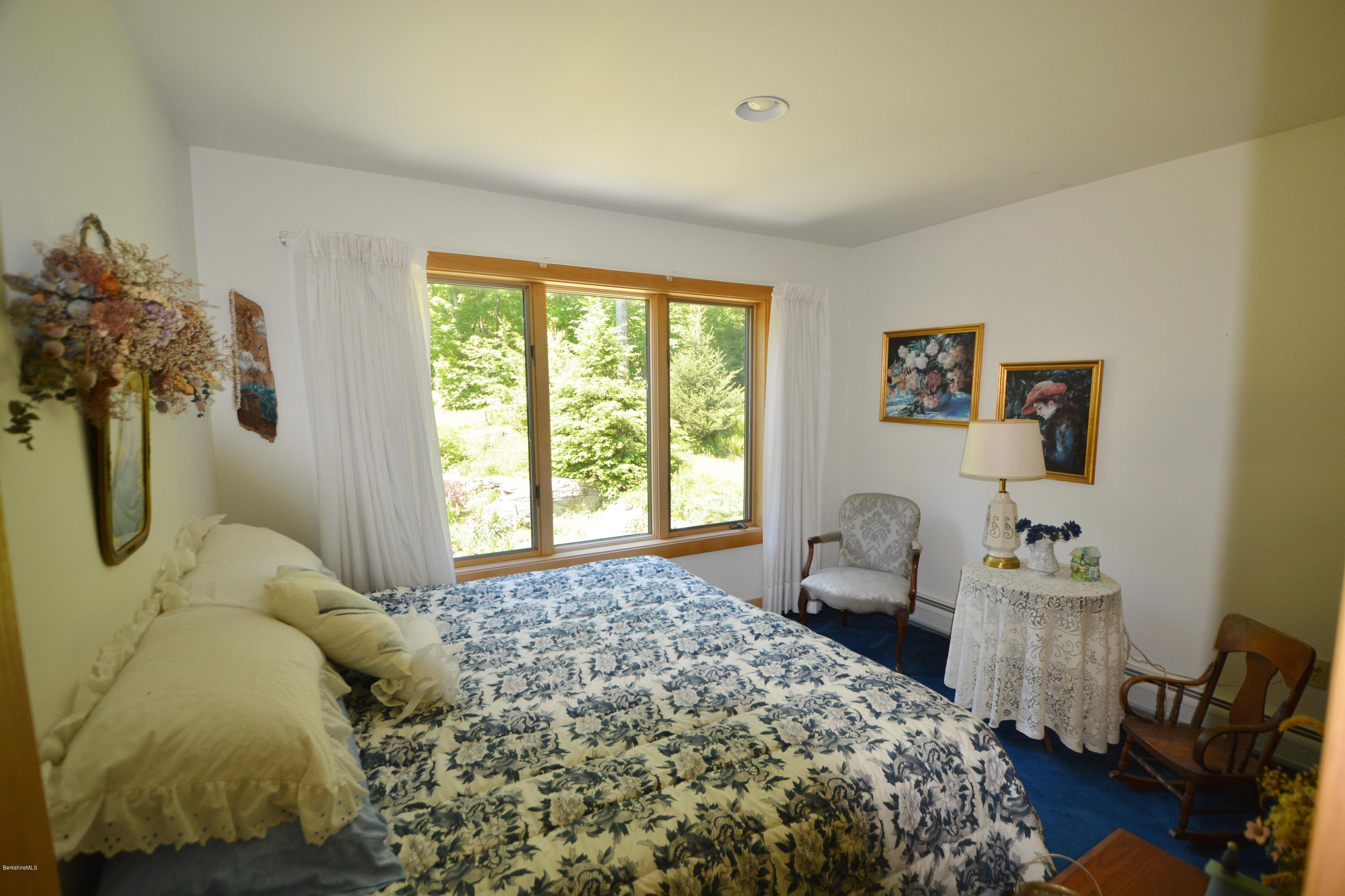 1304 West Center Road Otis, MA 01253 - Photo 17 of 28 a bedroom with a bed and a window
