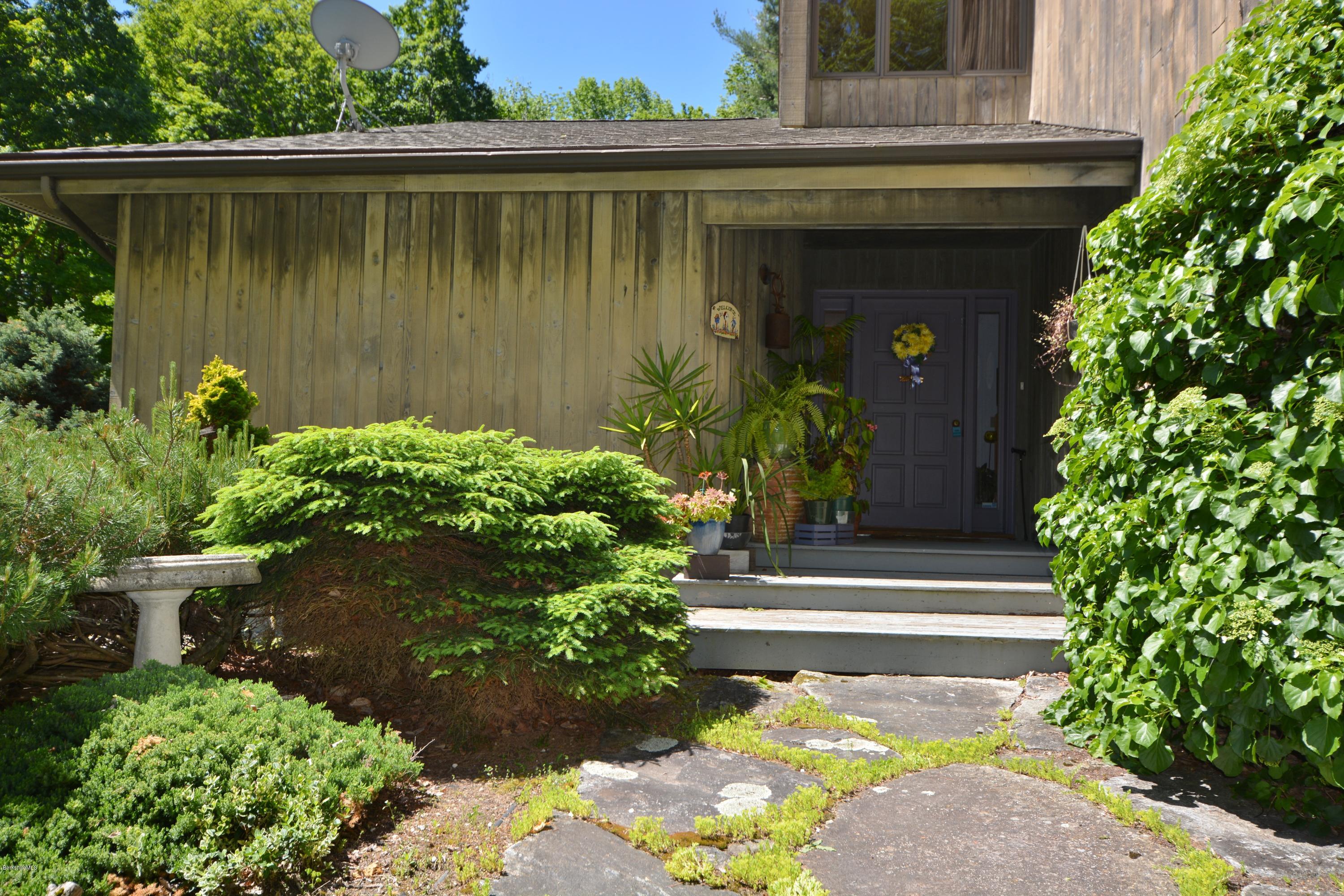 1304 West Center Road Otis, MA 01253 - Photo 3 of 28 a view of a pathway of a house