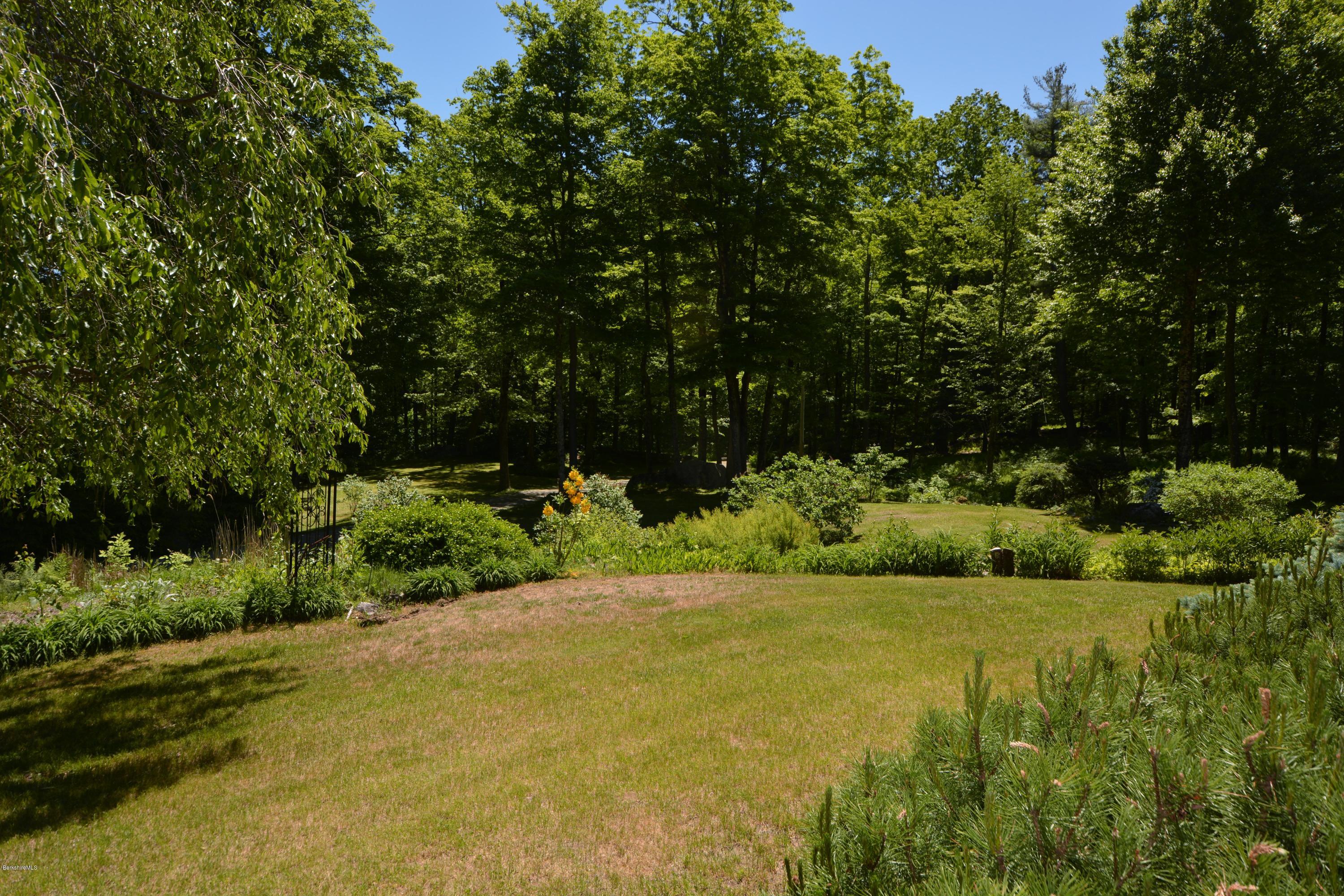1304 West Center Road Otis, MA 01253 - Photo 23 of 28 a view of an outdoor space and a yard