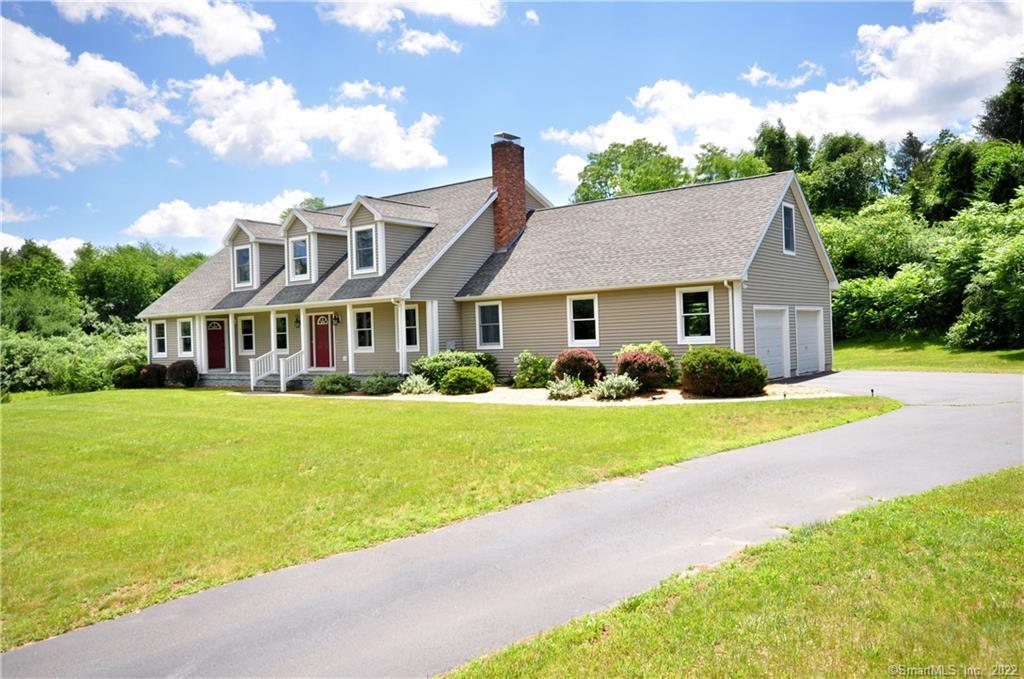 34 R Granby Farms Road Granby, CT 06035 - Photo 1 of 1 a front view of house with yard and green space
