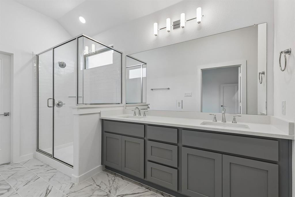 1429 Companero Street Haslet, TX 76052 - Photo 20 of 35 a bathroom with a double vanity sink mirror and double