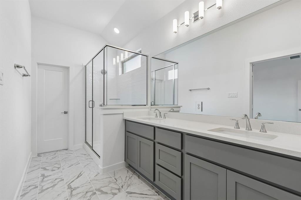 1429 Companero Street Haslet, TX 76052 - Photo 21 of 35 a bathroom with a double vanity sink mirror and
