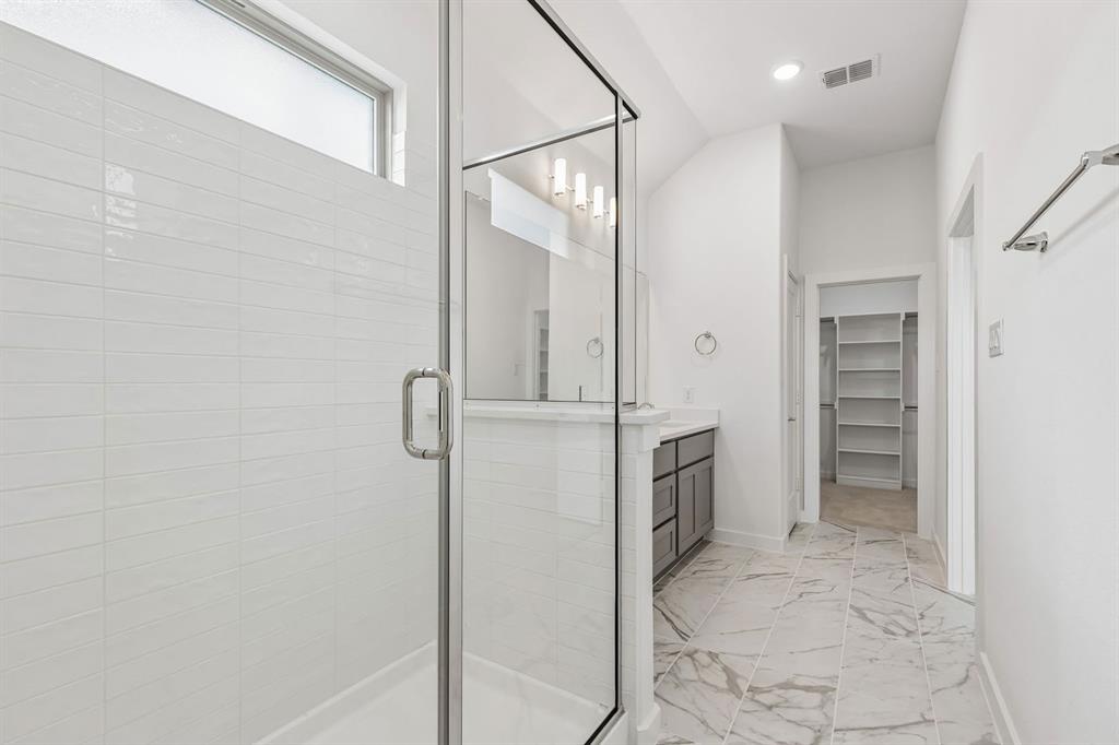 1429 Companero Street Haslet, TX 76052 - Photo 23 of 35 a bathroom with a shower and a sink