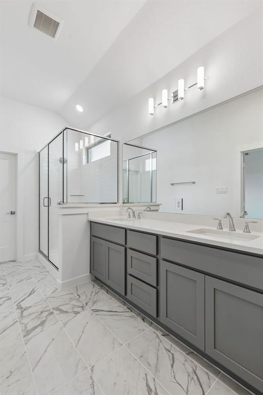 1429 Companero Street Haslet, TX 76052 - Photo 24 of 35 a spacious bathroom with a sink double vanity and a mirror