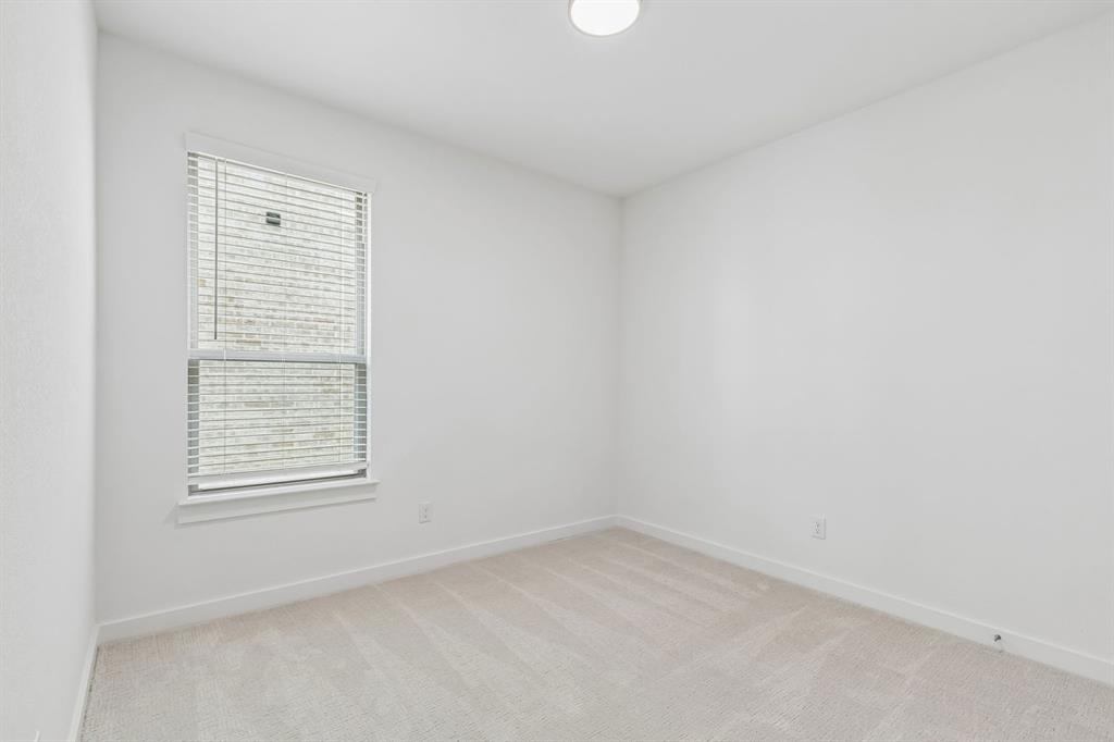 1429 Companero Street Haslet, TX 76052 - Photo 28 of 35 an empty room with a window