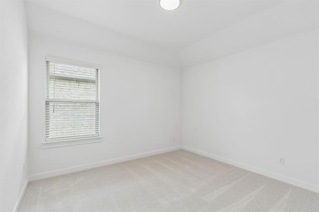 1429 Companero Street Haslet, TX 76052 - Photo 29 of 35 an empty room with a window