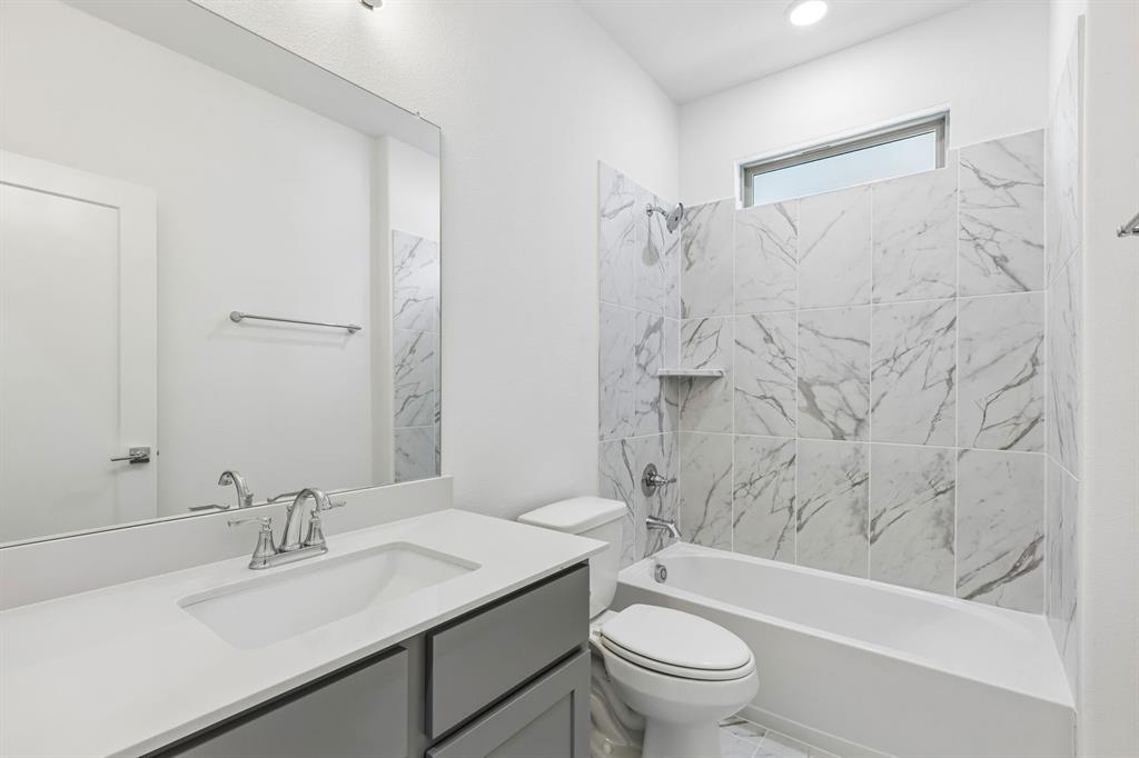 1429 Companero Street Haslet, TX 76052 - Photo 31 of 35 a bathroom with a sink toilet and shower