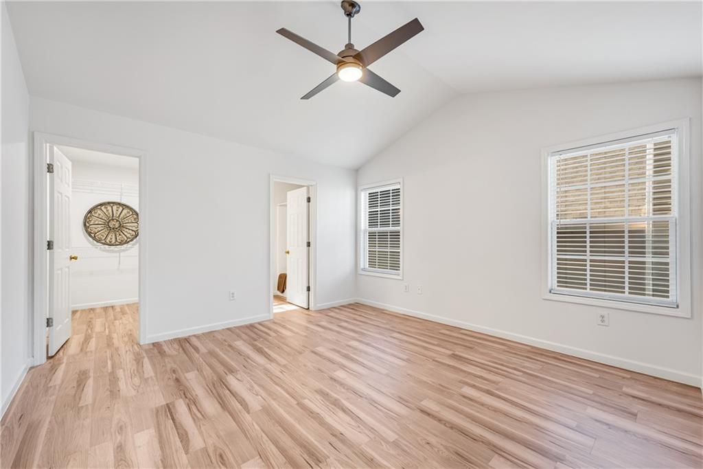125 Pine Ridge Trace Athens, GA 30605 - Photo 12 of 28 a view of a room with wooden floor and a ceiling fan