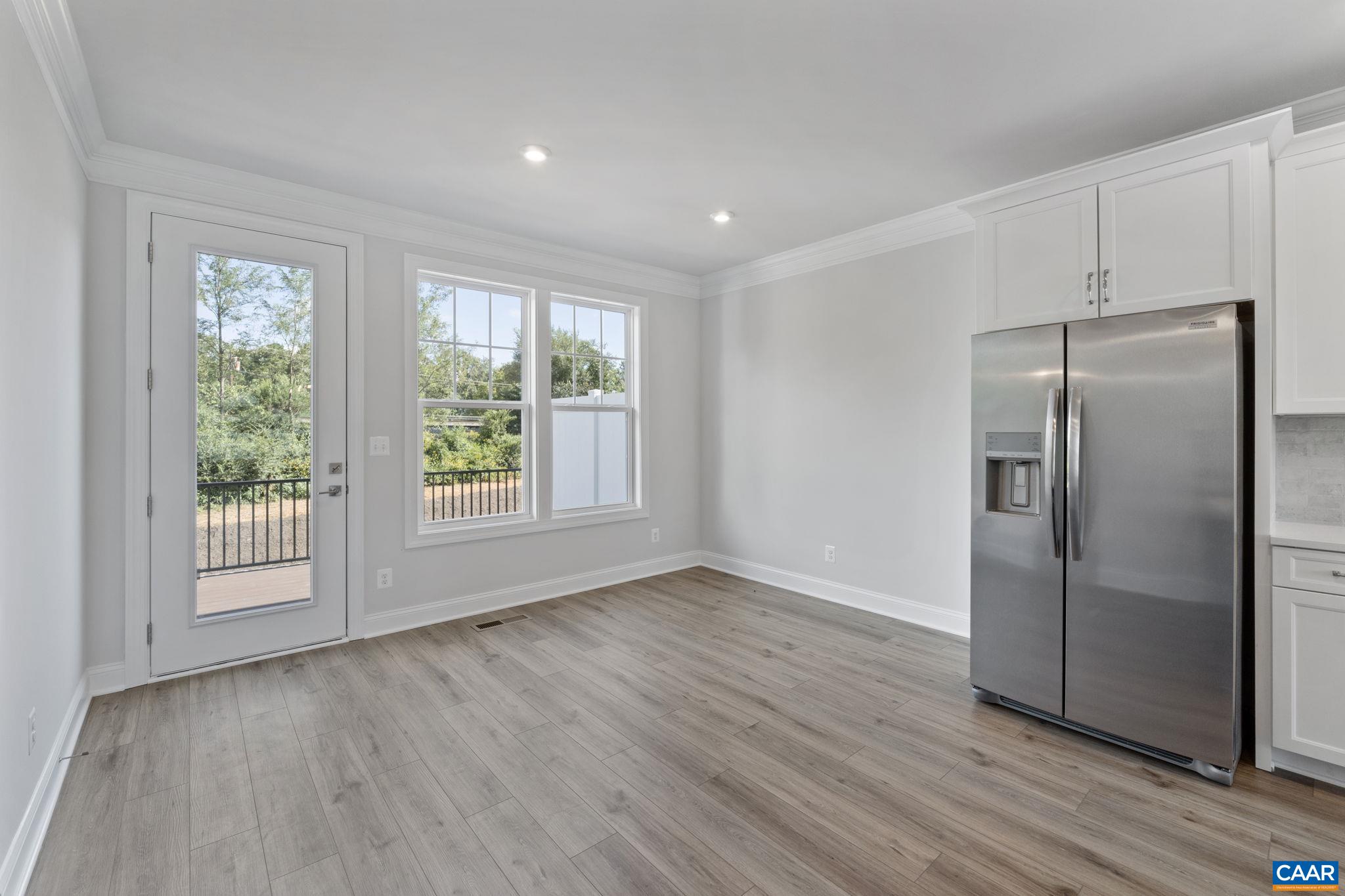 108 Park Ridge Drive Crozet, VA 22932 - Photo 19 of 54 a view of an empty room with wooden floor and a window
