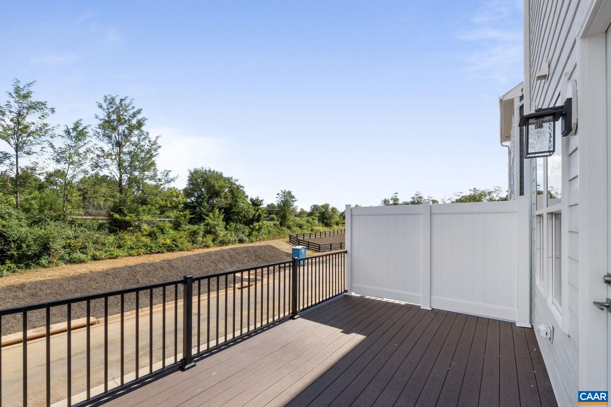 108 Park Ridge Drive Crozet, VA 22932 - Photo 20 of 54 a view of a balcony with wooden floor and fence