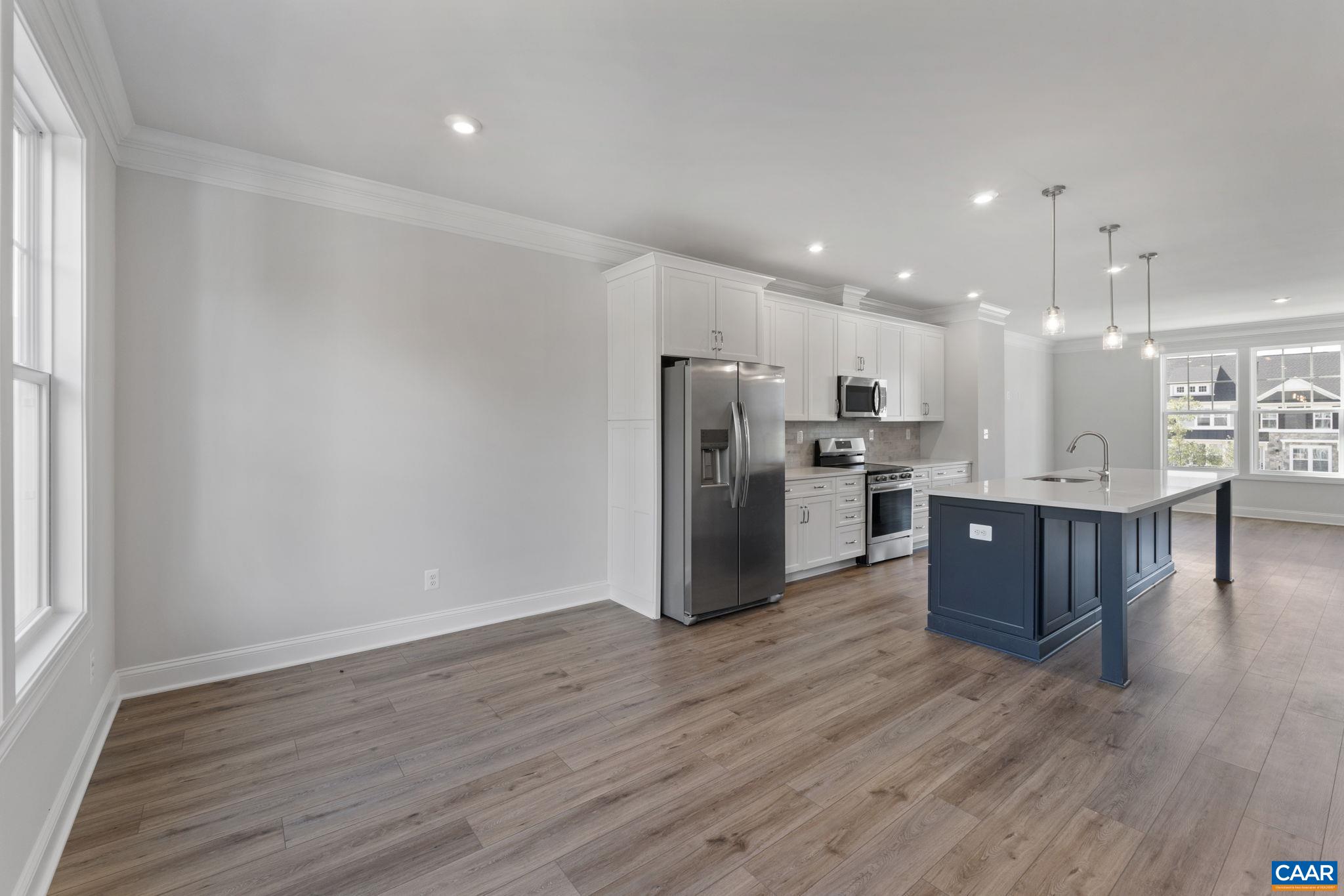 108 Park Ridge Drive Crozet, VA 22932 - Photo 22 of 54 a kitchen with stainless steel appliances kitchen island granite countertop wooden floors and view living room