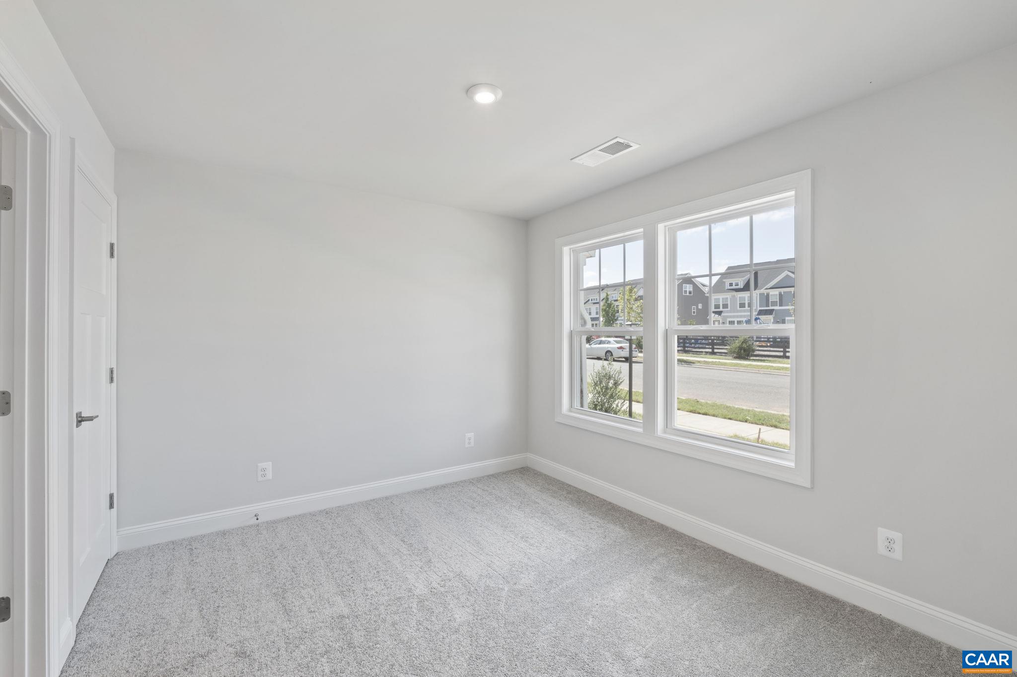 108 Park Ridge Drive Crozet, VA 22932 - Photo 9 of 54 a view of an empty room with a window