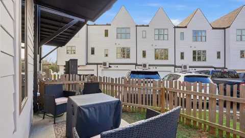 a view of a chair and table in the balcony