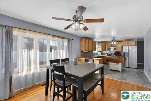 a view of a livingroom with workspace and a window