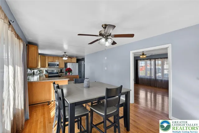a kitchen with a refrigerator a stove and a microwave