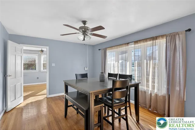 a living room with furniture and windows