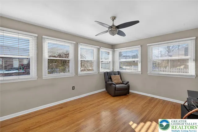 a view of a hallway with a wooden door