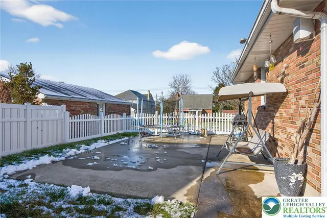 a view of a patio with table and chairs and potted plants