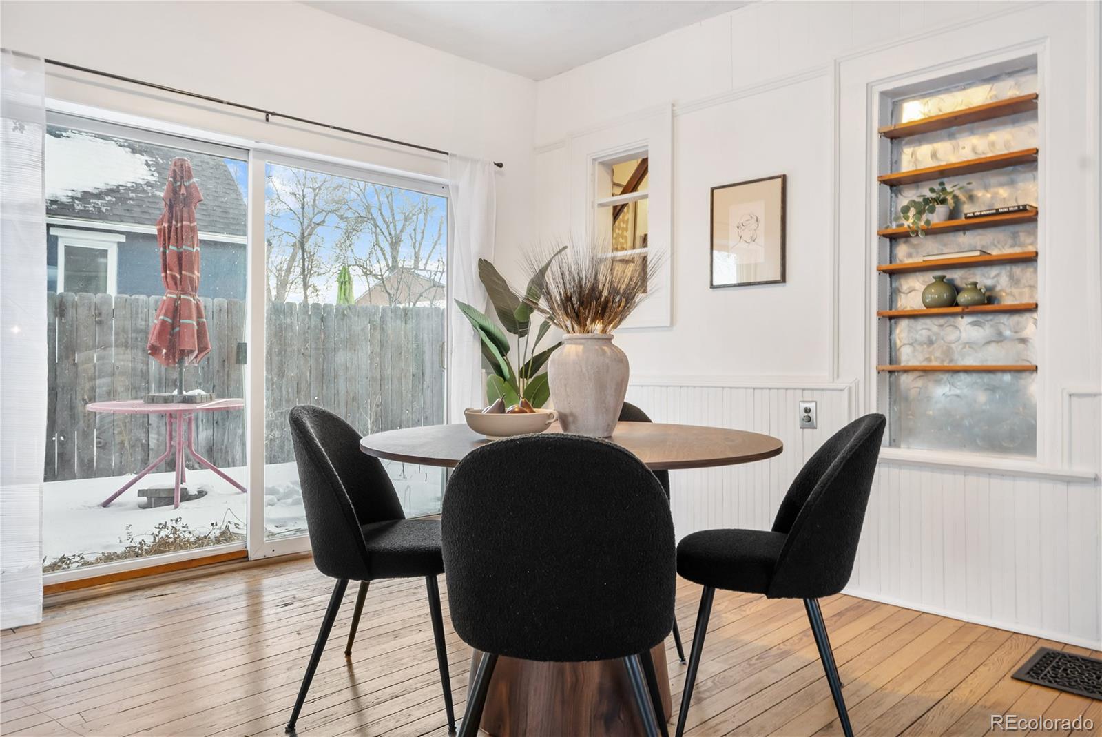 4743 Tejon Street Denver, CO 80211 - Photo 12 of 30 a view of a dining room with furniture and wooden floor