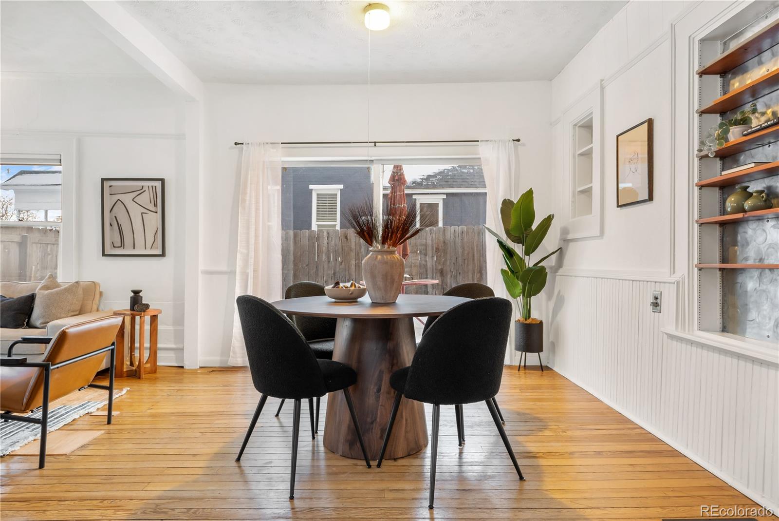 4743 Tejon Street Denver, CO 80211 - Photo 13 of 30 a dining room with furniture a rug and wooden floor