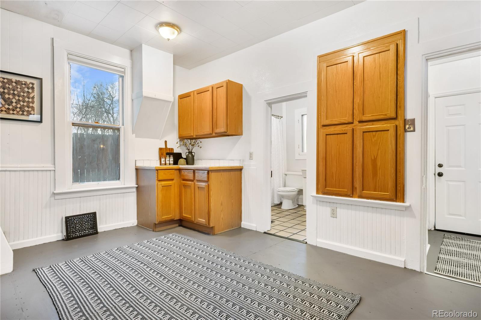 4743 Tejon Street Denver, CO 80211 - Photo 17 of 30 a bedroom with a bed and a window